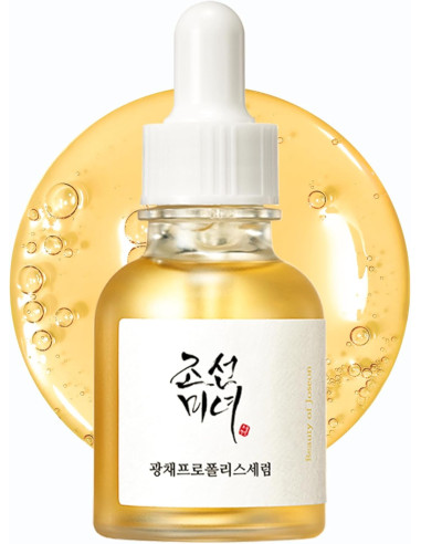 Beauty of Joseon Glow Serum med propolis och niacinamid i glasflaska med pipett och gyllene serum